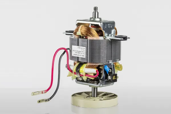 Blender motor taken out of the blender, showing the copper windings